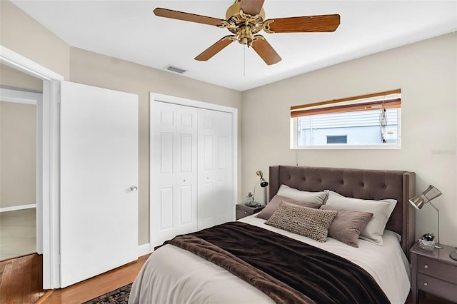250 W Canal Dr, Palm Harbor, FL 34684 - bedroom with a closet, a ceiling fan, and wood finished floors