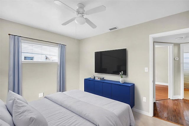 250 W Canal Dr, Palm Harbor, FL 34684 - bedroom with ceiling fan and wood finished floors