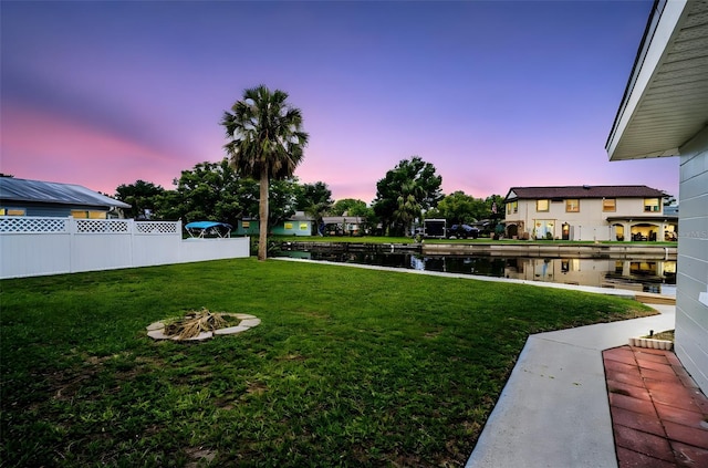 250 W Canal Dr, Palm Harbor, FL 34684 - view of yard with a water view and a fire pit