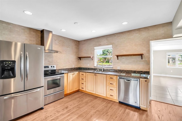 250 W Canal Dr, Palm Harbor, FL 34684 - kitchen with appliances with stainless steel finishes, wall chimney range hood, open shelves, healthy amount of natural light, and recessed lighting