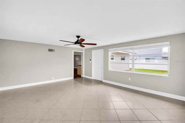 250 W Canal Dr, Palm Harbor, FL 34684 - empty room with ceiling fan and baseboards
