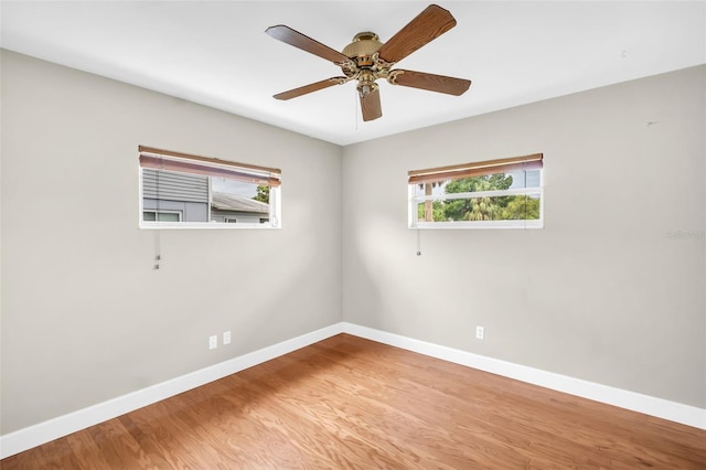250 W Canal Dr, Palm Harbor, FL 34684 - empty room with light wood-style flooring and a ceiling fan