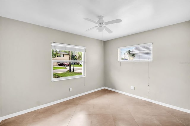 250 W Canal Dr, Palm Harbor, FL 34684 - tiled empty room featuring ceiling fan and baseboards