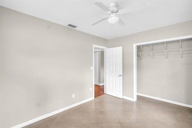 250 W Canal Dr, Palm Harbor, FL 34684 - unfurnished bedroom featuring a closet and ceiling fan
