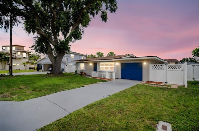 250 W Canal Dr, Palm Harbor, FL 34684 - view of front of home with driveway, a garage, and stucco siding