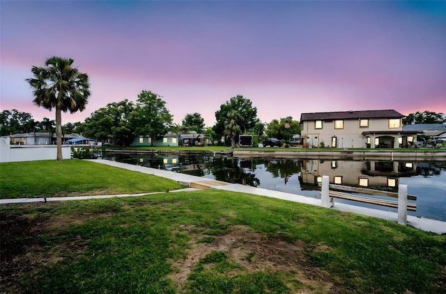 250 W Canal Dr, Palm Harbor, FL 34684 - dock featuring a water view and a lawn