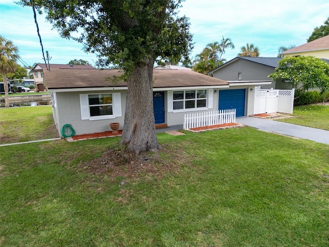 250 W Canal Dr, Palm Harbor, FL 34684 - view of front of home with driveway, a garage, and a shingled roof