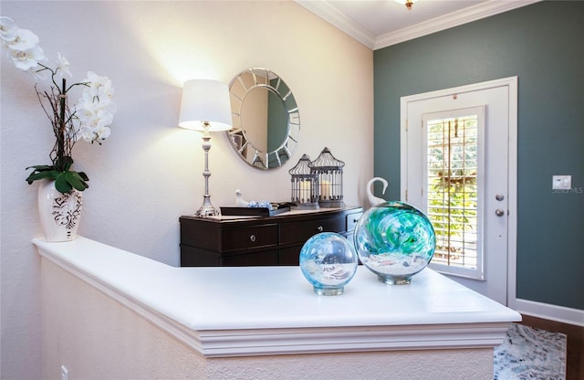 6303 Vista Verde Dr E, Gulfport, FL 33707 - foyer featuring crown molding, baseboards, and wood finished floors