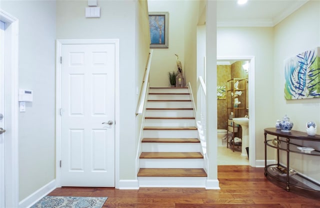 6303 Vista Verde Dr E, Gulfport, FL 33707 - stairway with baseboards, ornamental molding, and wood finished floors