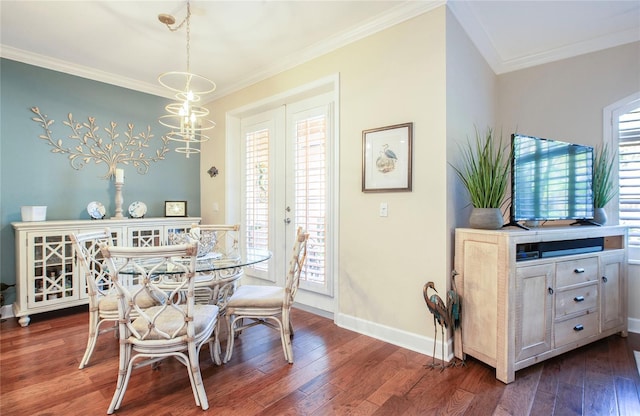 6303 Vista Verde Dr E, Gulfport, FL 33707 - dining space featuring crown molding, baseboards, and wood finished floors