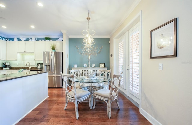 6303 Vista Verde Dr E, Gulfport, FL 33707 - dining room with crown molding, recessed lighting, baseboards, and dark wood finished floors