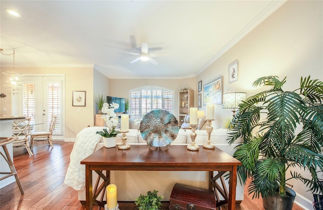 6303 Vista Verde Dr E, Gulfport, FL 33707 - living area with a ceiling fan, baseboards, ornamental molding, and wood finished floors