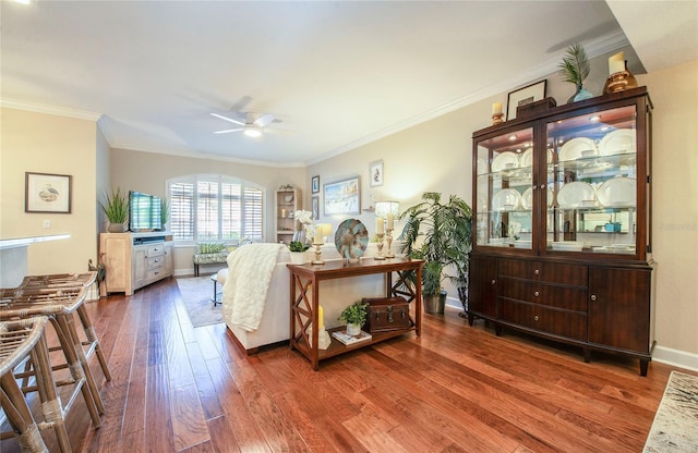 6303 Vista Verde Dr E, Gulfport, FL 33707 - living room with wood-type flooring, ceiling fan, ornamental molding, and baseboards