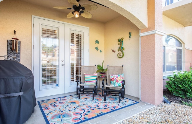 6303 Vista Verde Dr E, Gulfport, FL 33707 - property entrance featuring a patio, ceiling fan, french doors, and stucco siding