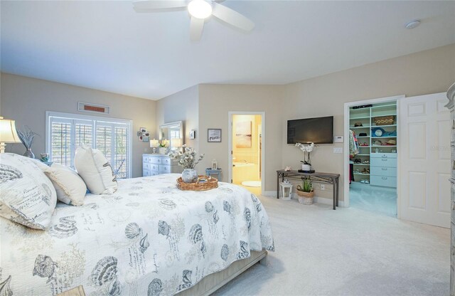 6303 Vista Verde Dr E, Gulfport, FL 33707 - bedroom with carpet floors, a closet, ensuite bathroom, ceiling fan, and a spacious closet