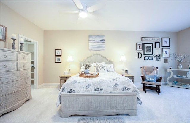 6303 Vista Verde Dr E, Gulfport, FL 33707 - bedroom featuring light colored carpet, a ceiling fan, and baseboards