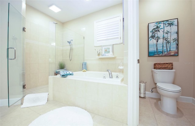 6303 Vista Verde Dr E, Gulfport, FL 33707 - bathroom with tile patterned floors, a stall shower, toilet, and a garden tub