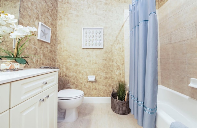 6303 Vista Verde Dr E, Gulfport, FL 33707 - full bathroom featuring vanity, tile patterned flooring, shower / bath combination with curtain, toilet, and baseboards