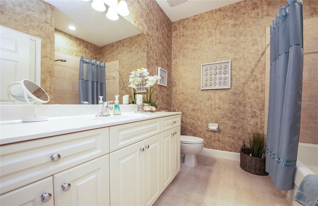 6303 Vista Verde Dr E, Gulfport, FL 33707 - bathroom with baseboards, toilet, and vanity