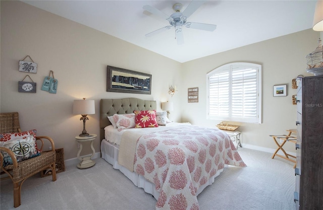 6303 Vista Verde Dr E, Gulfport, FL 33707 - bedroom featuring baseboards, ceiling fan, and light carpet