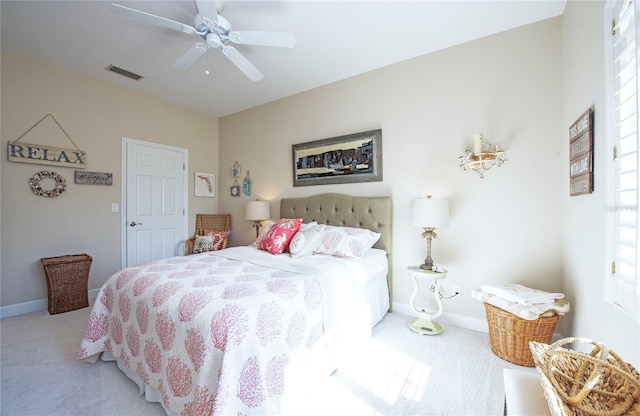 6303 Vista Verde Dr E, Gulfport, FL 33707 - bedroom with visible vents, a ceiling fan, baseboards, and light carpet