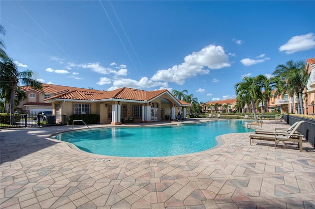 6303 Vista Verde Dr E, Gulfport, FL 33707 - pool featuring fence and a patio area