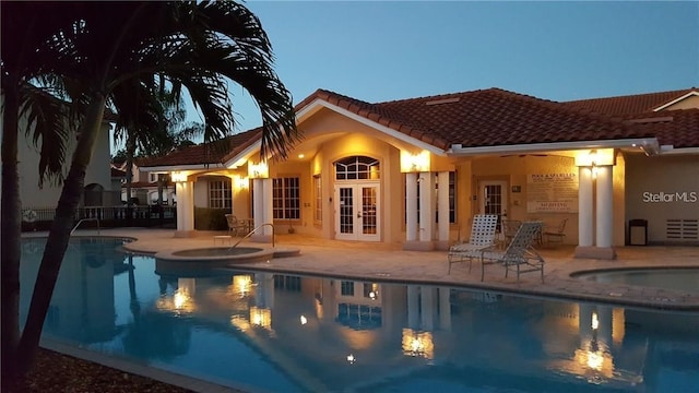 6303 Vista Verde Dr E, Gulfport, FL 33707 - outdoor pool with a patio area, french doors, and an in ground hot tub