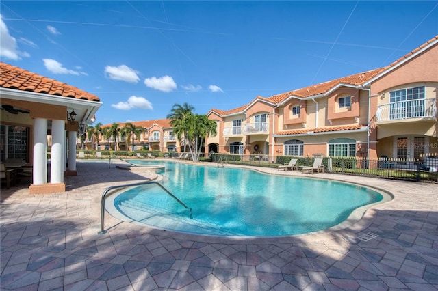 6303 Vista Verde Dr E, Gulfport, FL 33707 - community pool with a patio and fence