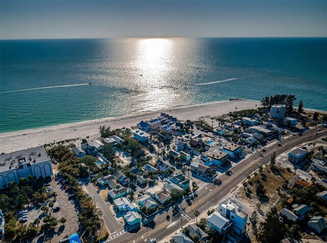 aerial view with a water view and a view of the beach