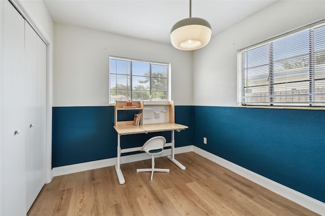 office featuring wood finished floors and baseboards