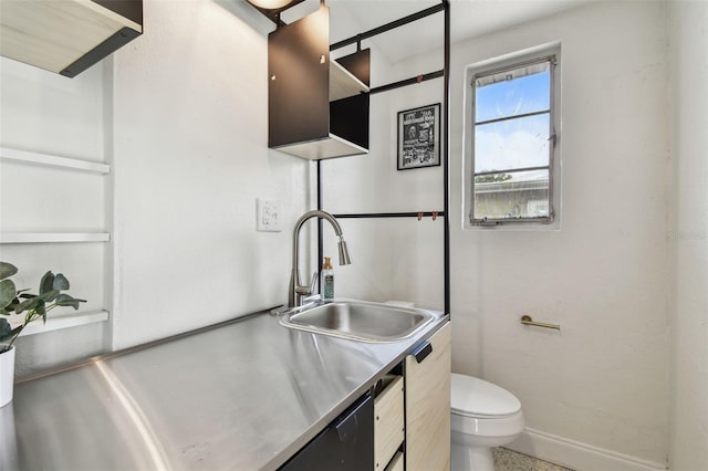 bathroom with toilet, baseboards, and vanity