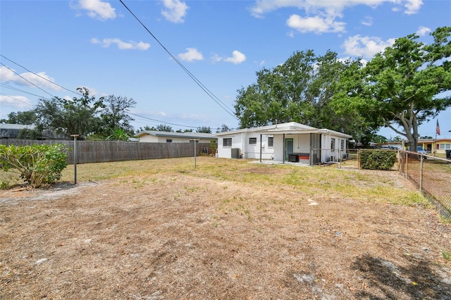 view of yard with central AC