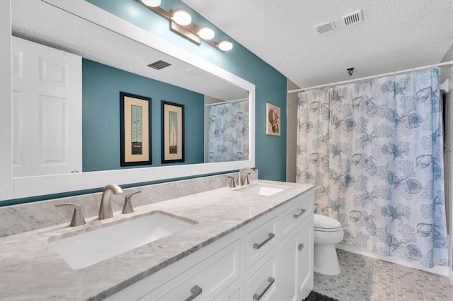 15400 Gulf Blvd Unit 202, Madeira Beach, FL 33708 - bathroom with a sink, a textured ceiling, and visible vents