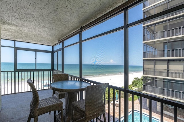 15400 Gulf Blvd Unit 202, Madeira Beach, FL 33708 - sunroom / solarium with a water view and a beach view