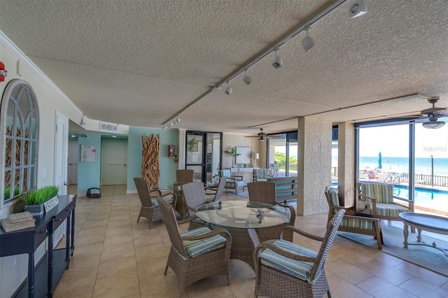 15400 Gulf Blvd Unit 202, Madeira Beach, FL 33708 - view of patio / terrace with a ceiling fan, outdoor dining space, and visible vents