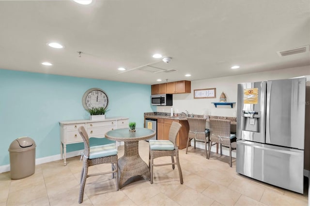 15400 Gulf Blvd Unit 202, Madeira Beach, FL 33708 - dining room with baseboards, recessed lighting, wet bar, and visible vents