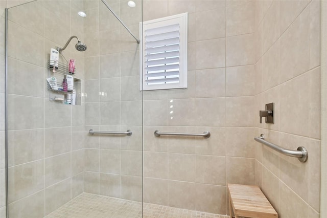full bathroom with a tile shower