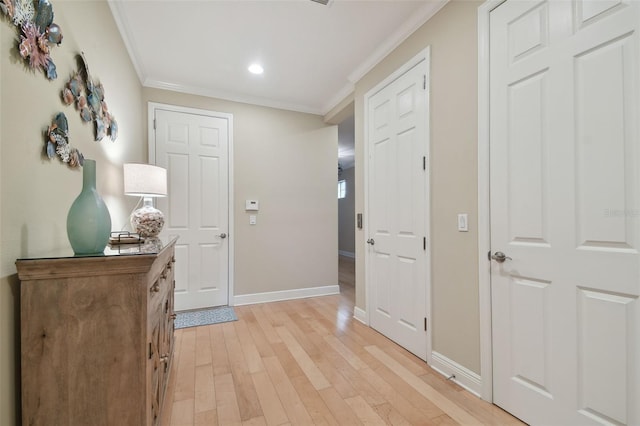 interior space with recessed lighting, baseboards, ornamental molding, and light wood finished floors
