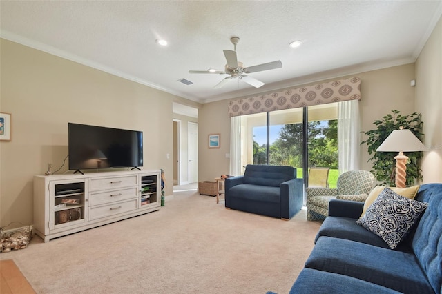 carpeted living room featuring crown molding, a ceiling fan, recessed lighting, and visible vents