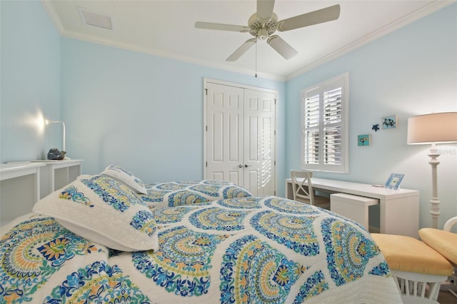 bedroom featuring ornamental molding, a ceiling fan, a closet, and visible vents