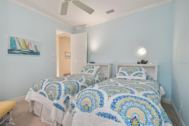 carpeted bedroom featuring visible vents, baseboards, crown molding, and ceiling fan
