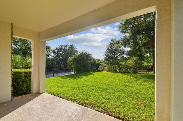 view of yard featuring fence and a patio area