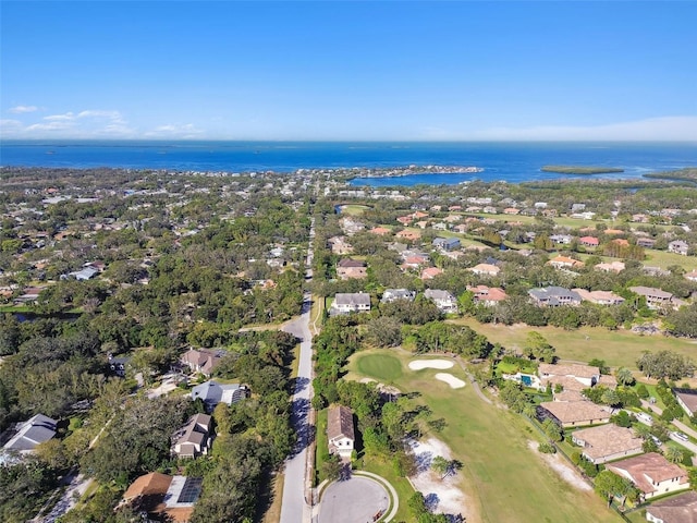bird's eye view with a water view, view of golf course, and a residential view