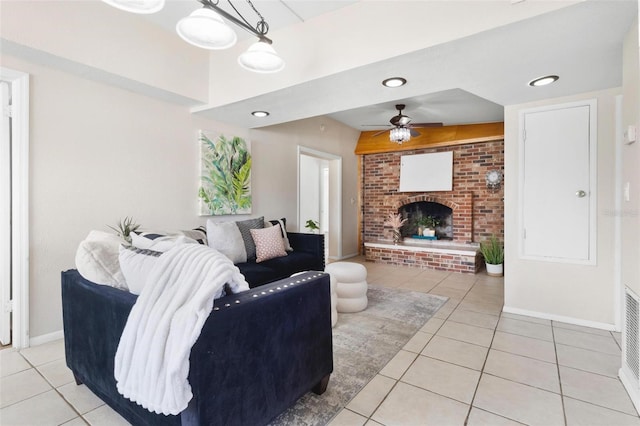 8184 Rose Ter, Seminole, FL 33777 - living area with light tile patterned flooring, a fireplace, a ceiling fan, and baseboards