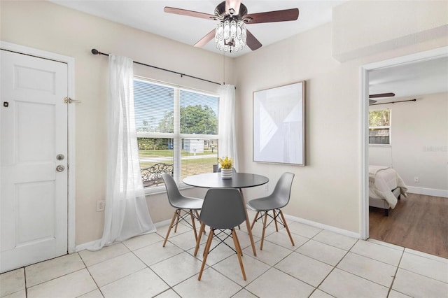 8184 Rose Ter, Seminole, FL 33777 - dining space with a wealth of natural light, a ceiling fan, and baseboards