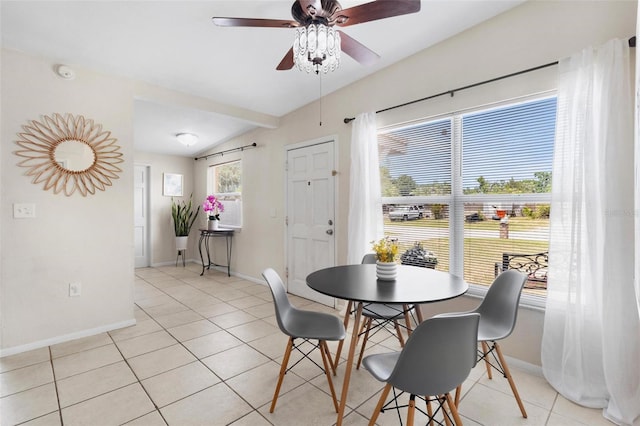 8184 Rose Ter, Seminole, FL 33777 - dining space with lofted ceiling, baseboards, light tile patterned floors, and ceiling fan