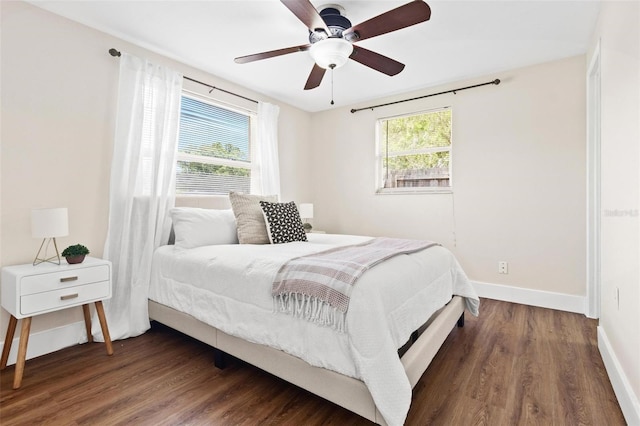 8184 Rose Ter, Seminole, FL 33777 - bedroom featuring baseboards, a ceiling fan, and wood finished floors