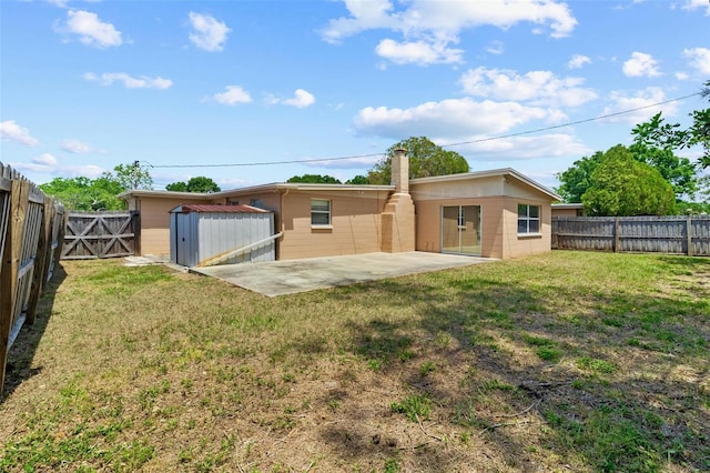 8184 Rose Ter, Seminole, FL 33777 - back of property featuring a fenced backyard, a shed, a yard, and a patio