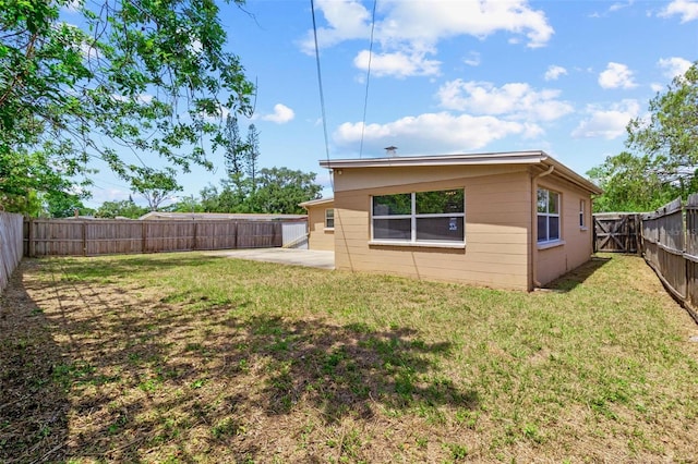 8184 Rose Ter, Seminole, FL 33777 - exterior space with a fenced backyard, a yard, and a patio