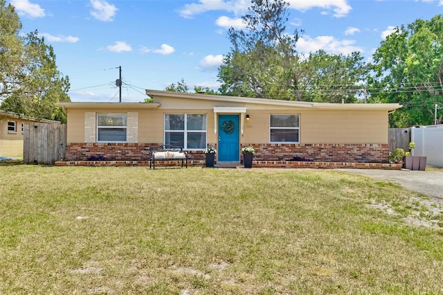 8184 Rose Ter, Seminole, FL 33777 - single story home with fence, brick siding, and a front yard